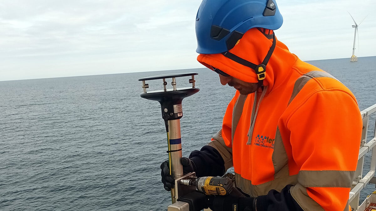 Engineer installing Fern MetOcean weather sensor